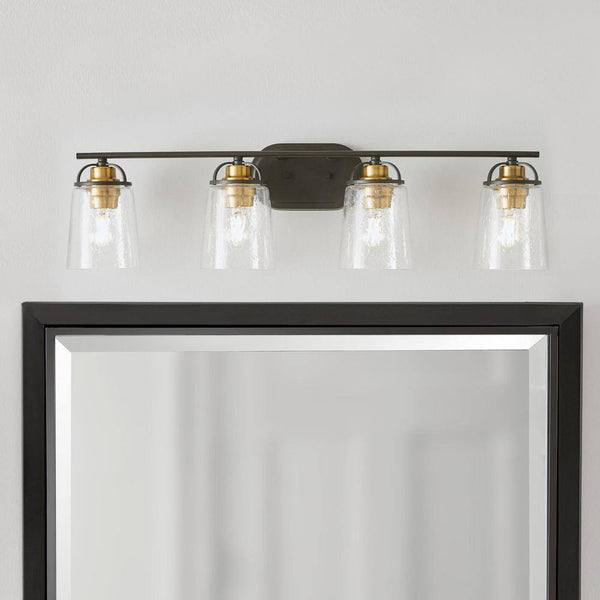 Goddard 33.18 in. 4-Light Bronze Industrial Bathroom Vanity Light with Vintage Brass Accents and Clear Seeded Glass 1950